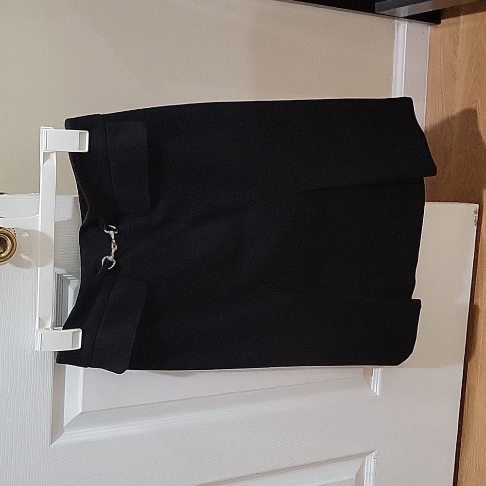 A classic pencil skirt with 2 front false splits.  It is very flattering.